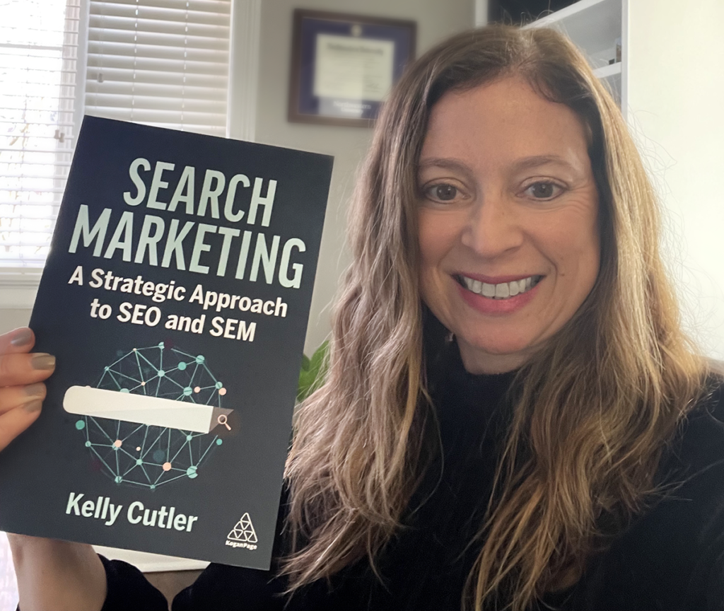 Kelly Cutler holding Search Marketing Book